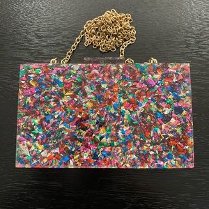 Acrylic glitter clutch with removable gold chain. Multicolor